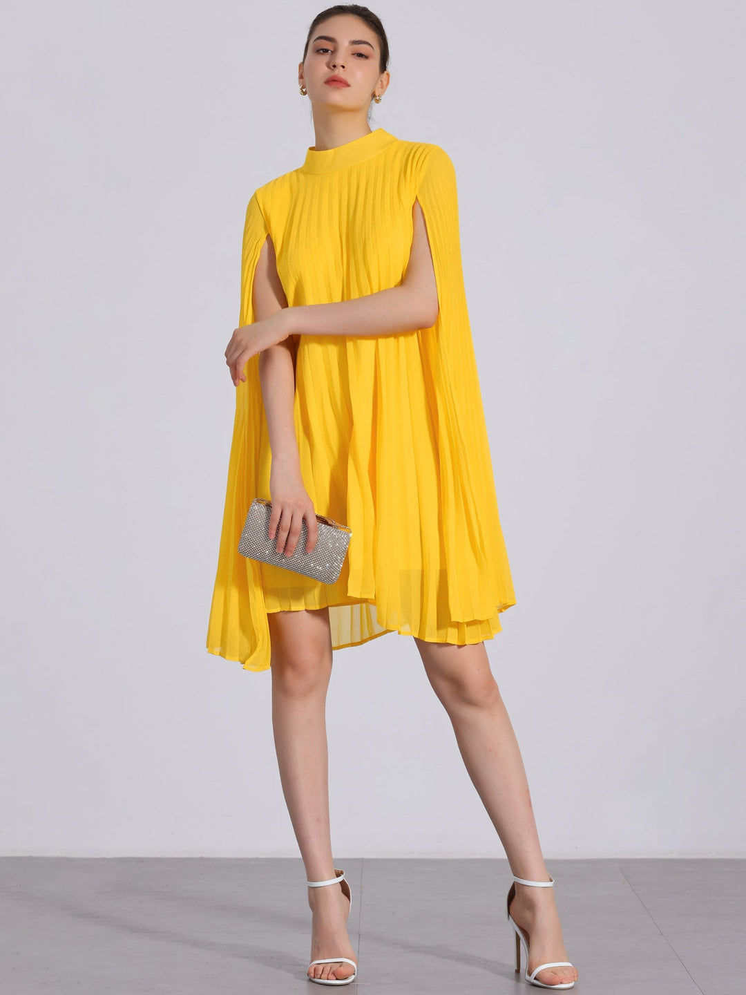 Elegant women's yellow pleated swing dress with flowing cape sleeves, perfect for summer parties & special occasions.