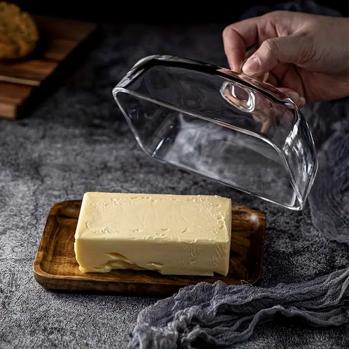 Stylish wood and glass butter holder, designed for easy access & fresh storage, enhances any kitchen tableware.