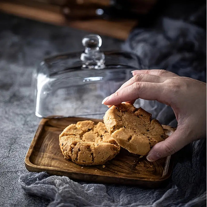 Modern bamboo wood butter dish with a durable glass lid, adding a touch of elegance to kitchen decor & serving.