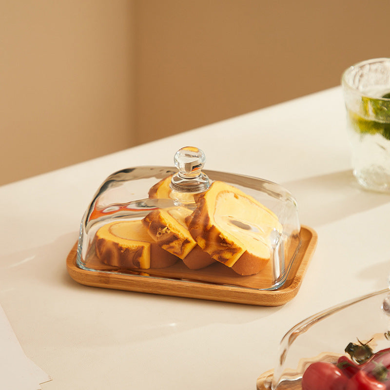 Chic wood and glass butter server, also suitable for cheese. An elegant tableware item for any dining setting.