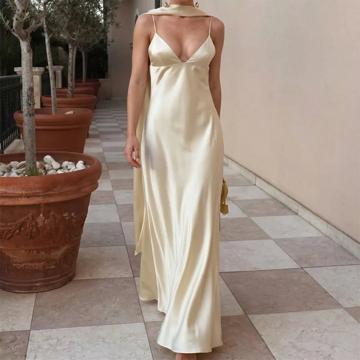 Elegant yellow women's long slip dress with a stylish open back and v-neck, perfect for evening wear & parties.