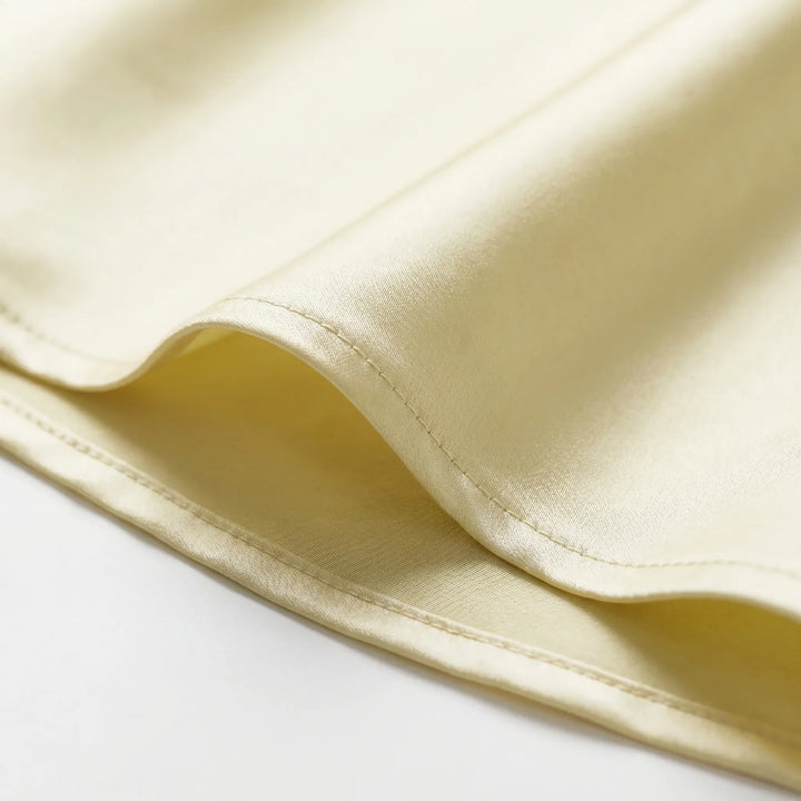 Long yellow women's party slip dress with an elegant open back design, v-neckline, and comfortable sleeveless cut.