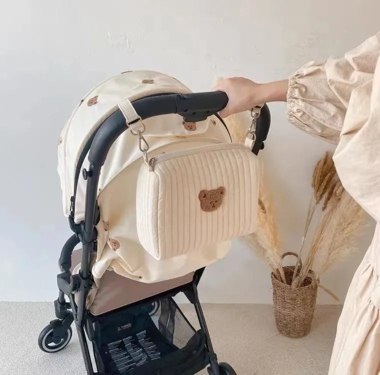 Portable diaper caddy bag for stroller, embroidered design, convenient baby travel storage