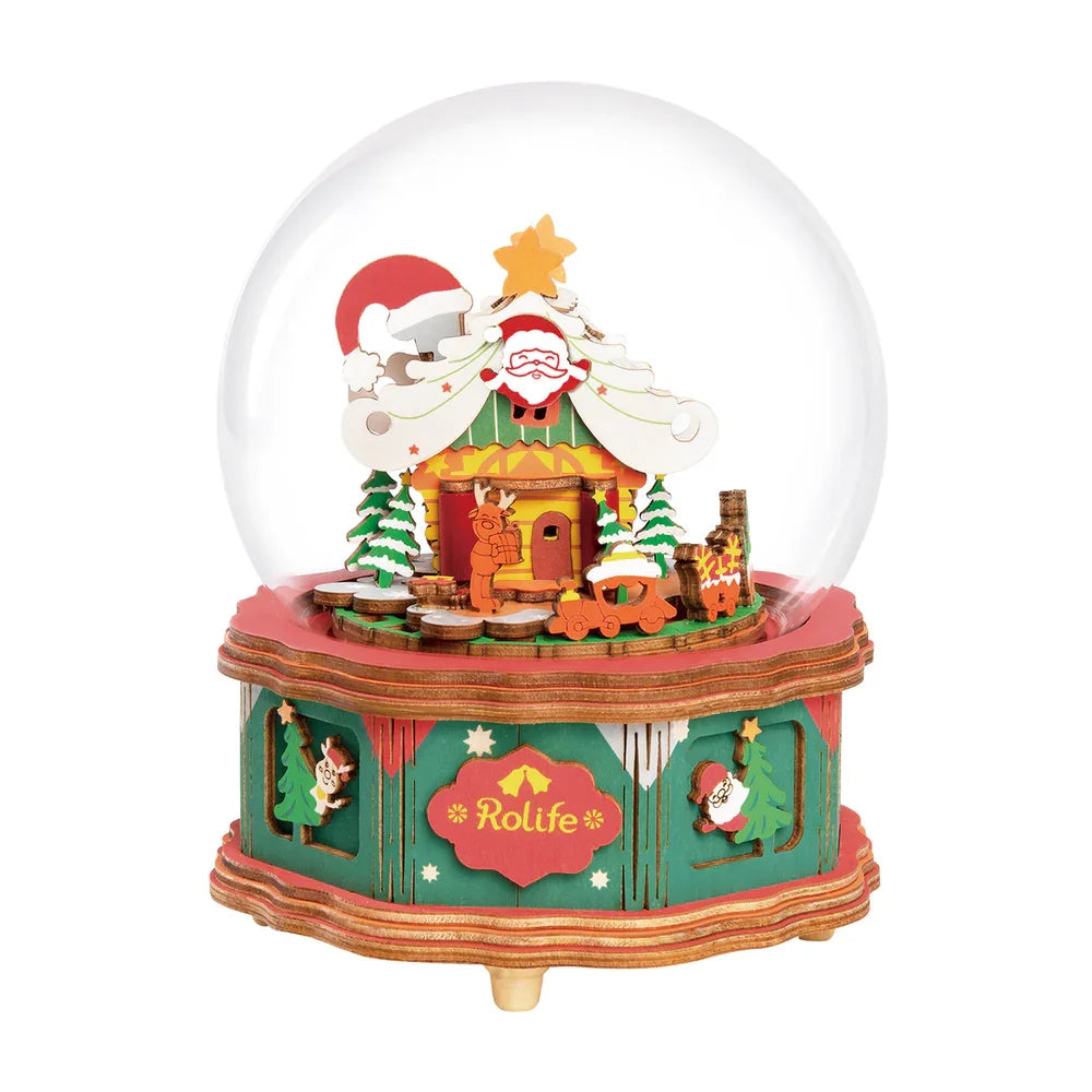 Winter wonderland crystal ball music box, illuminates with festive Christmas town scene and melodies