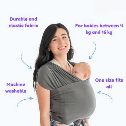 Happy baby sleeping soundly in a cozy ergonomic carrier wrap, promoting close contact bonding