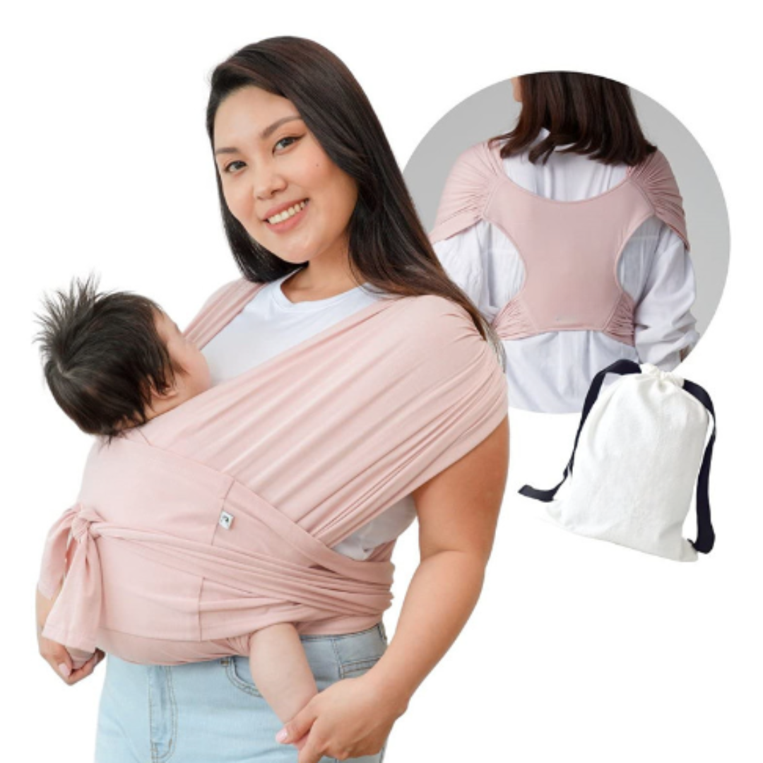 Parent comfortably wearing a newborn in an ergonomic baby wrap, perfect for baby care routine