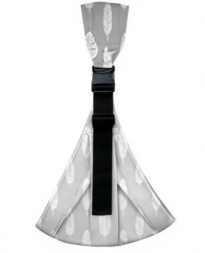 Close up of buckle and safety features on ergonomic baby hip carrier, wide strap