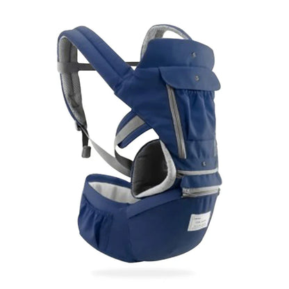 Baby smiling while sitting in a soft cotton ergonomic infant sling style hipseat carrier