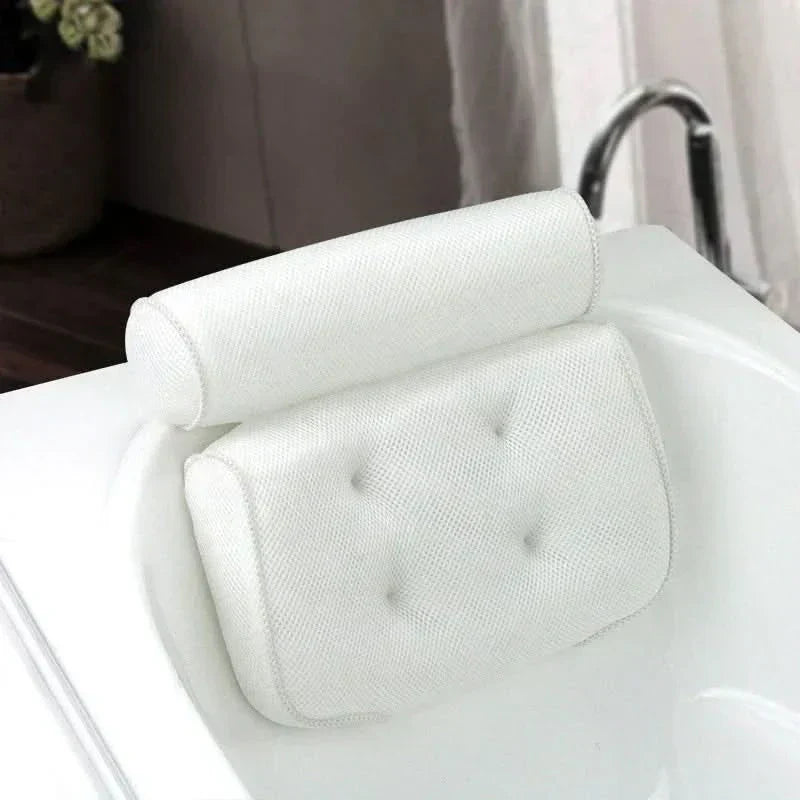 White ergonomic bath cushion with strong suction cups, providing head & neck support for a luxury spa bath experience.