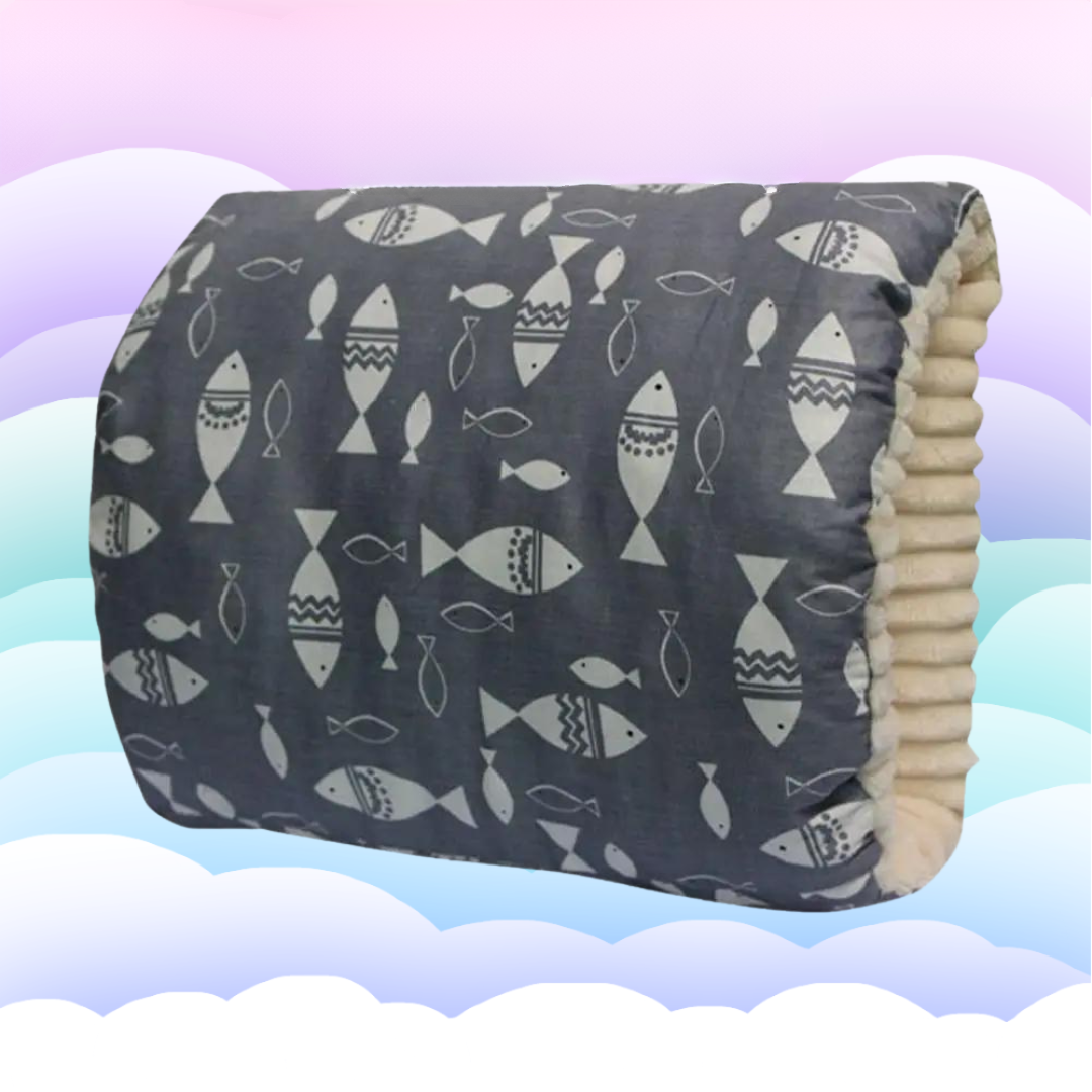 Side view of ergonomic nursing pillow, demonstrating its supportive shape for breastfeeding
