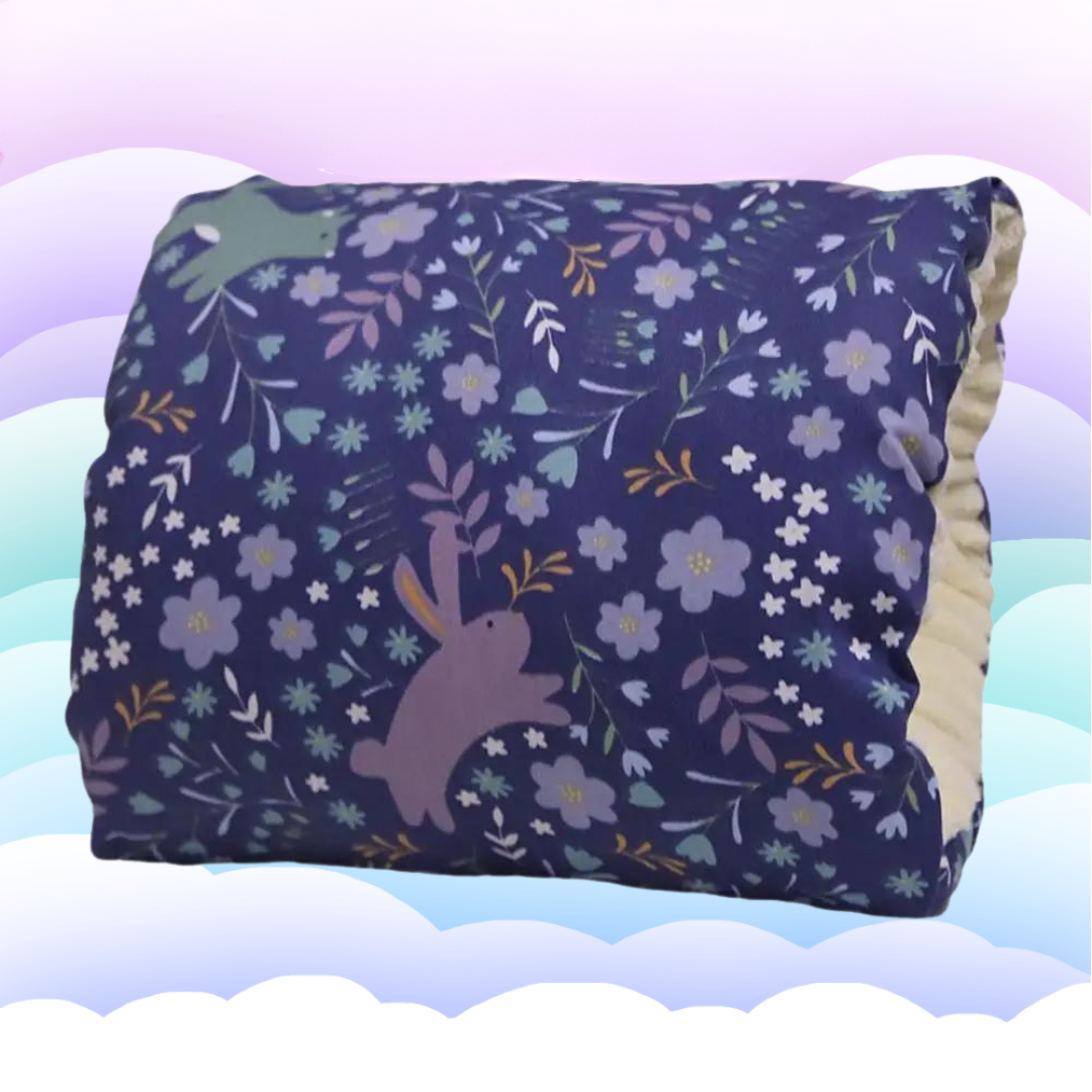 Packaged ergonomic nursing pillow, highlighting its washable and baby-friendly features