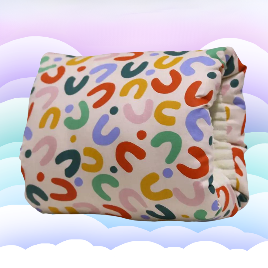 White ergonomic nursing pillow with grey trim, providing gentle support for baby during feeding