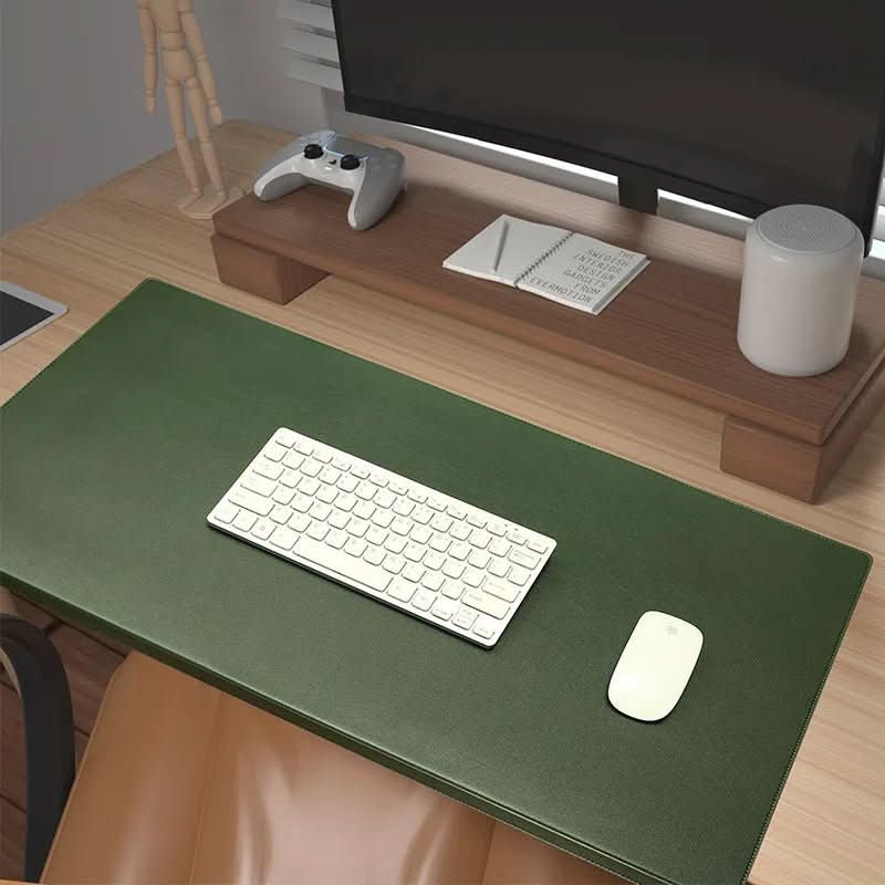 Durable PU leather desk mat with an ergonomic wrist rest, perfect for a comfortable & productive desk.