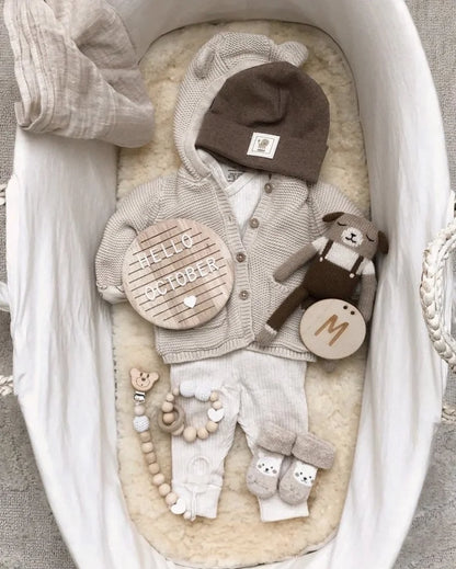 Wooden baby milestone board kit in European style, used as a unique baby shower gift.