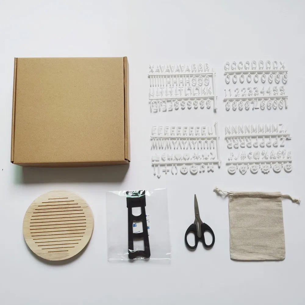 Baby accessories: oak milestone board kit with various age markers, suitable for a baby gift.