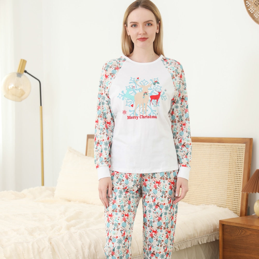 Closeup of a family Christmas pajama set's fabric showing festive holiday-themed print, soft cotton