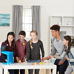 Family playing the Bouncing Ball Game on a table, showcasing a fun educational toy for kids