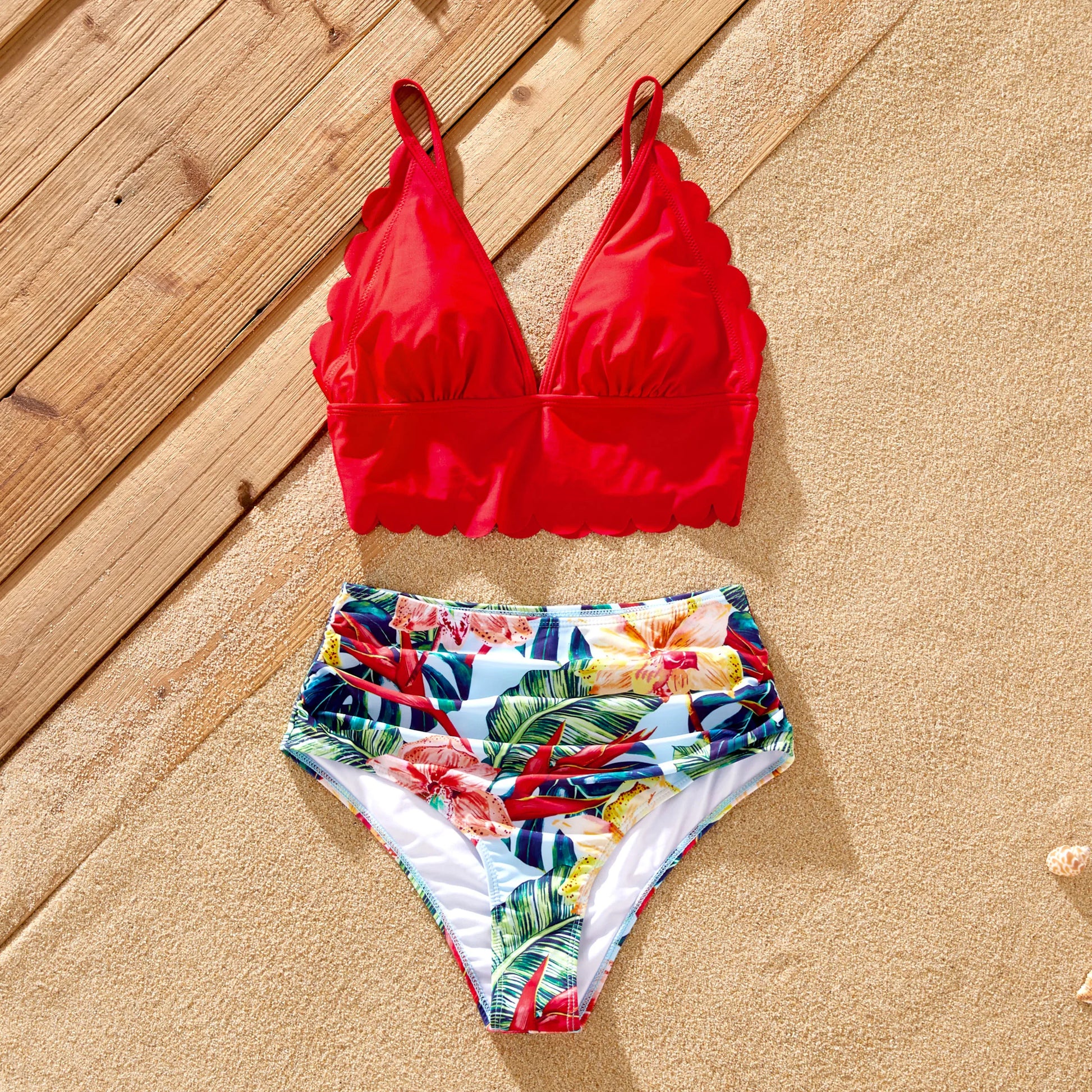 Kids boy and girl matching floral swim shorts and bikini top, family swimwear.