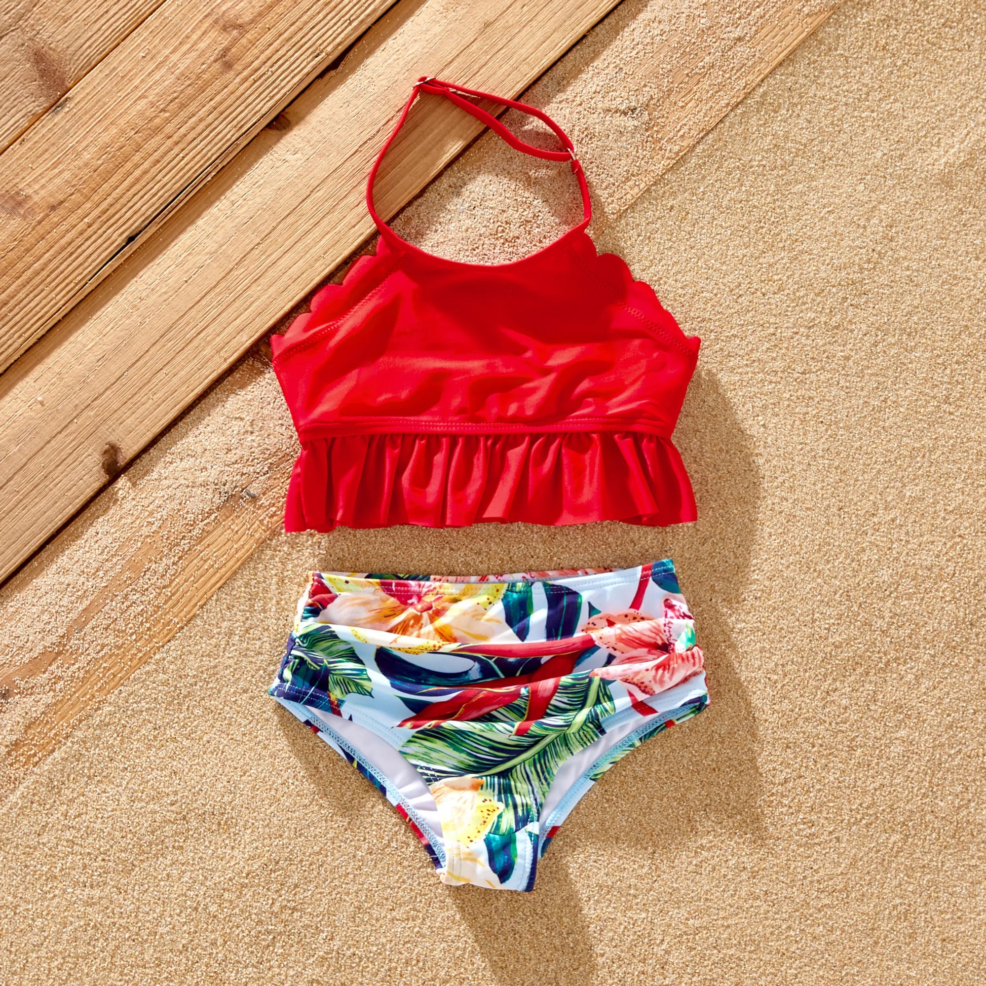 Women's pink floral one-piece swimsuit, part of a family matching set, poolside fashion.