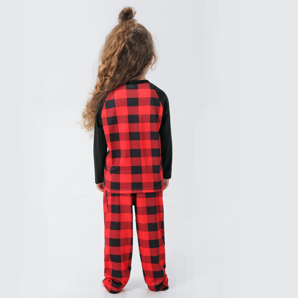 Matching Christmas pajama set folded, showing plaid and reindeer design for the whole family
