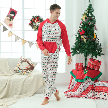 Baby wearing a cozy red Christmas tree print one-piece romper, crawling on a rug.