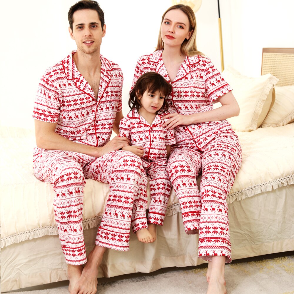 Close-up of red short-sleeve holiday pajama set made from soft polyester fabric