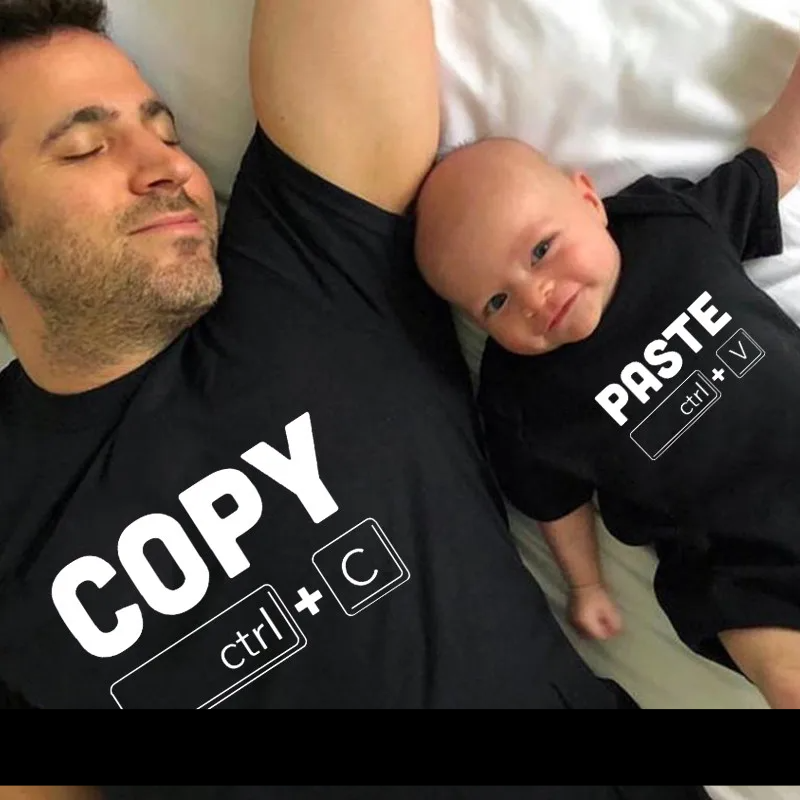 Full family shot wearing black and white copy paste t-shirts and rompers, casual matching set
