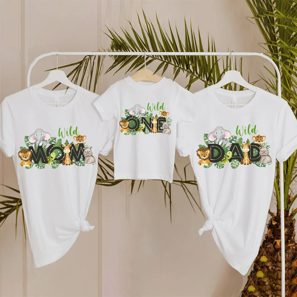 Family in matching wild print t-shirts & baby romper, casual summer outfit for fun.