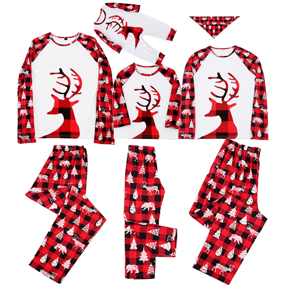 Happy family of four plus pet dog in festive matching Christmas plaid pajamas, holiday outfits.