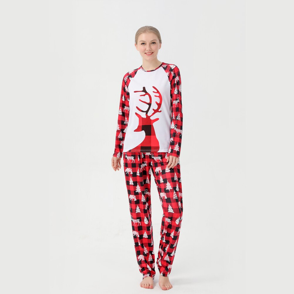 Close-up of parents and child wearing red and black buffalo plaid Christmas pajamas, cozy sleepwear.