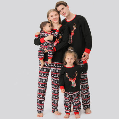 Family in red & black plaid elk Christmas pajamas, smiling, cozy holiday loungewear