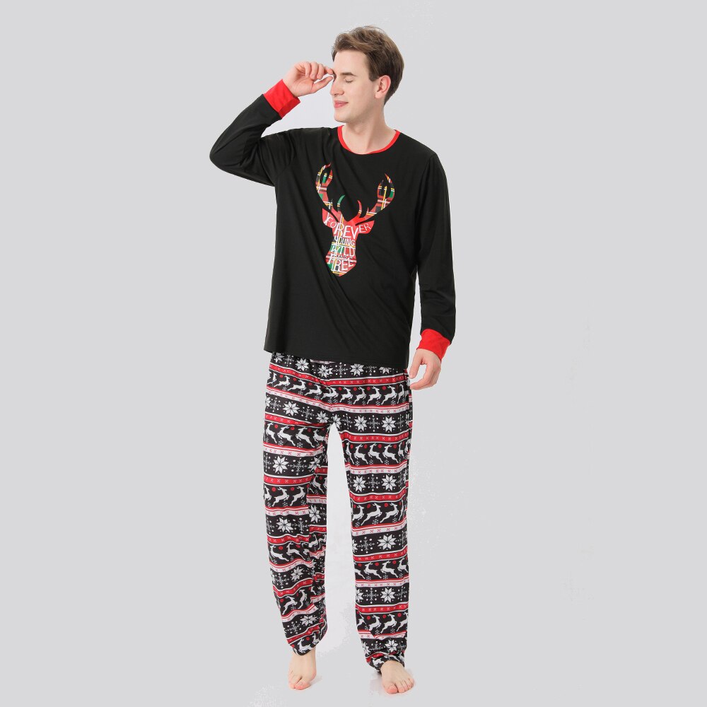 Toddler in cute elk design Christmas pajamas, playing on a rug, comfortable kids loungewear
