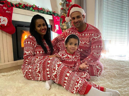 Close-up of festive pattern on red family Christmas pajamas, ideal holiday sleepwear design
