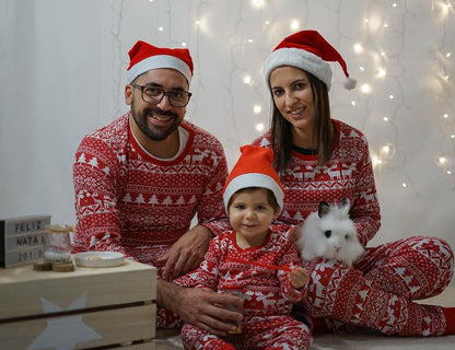 Baby in cozy red Christmas pajamas, cute holiday sleepwear for infants, festive outfits collection