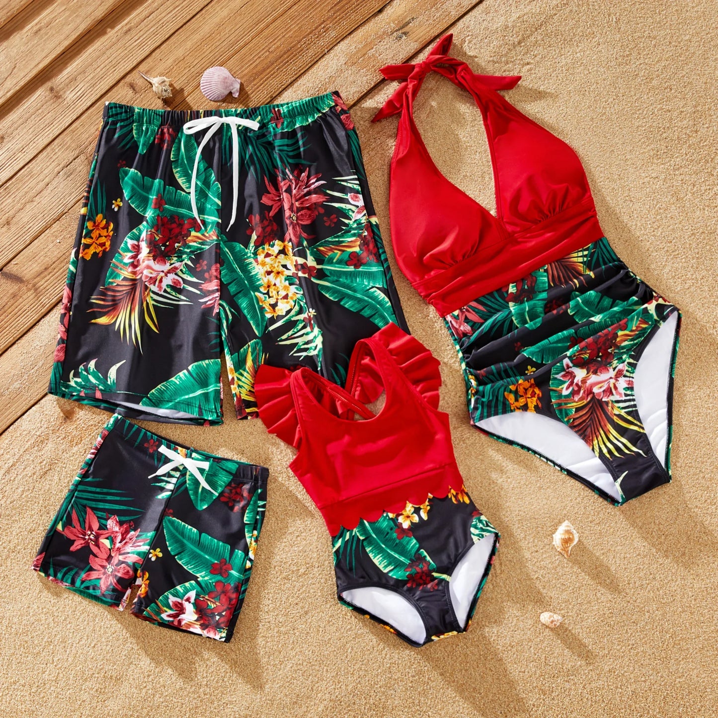 Family in tropical print matching swimsuits and drawstring trunks, perfect for beachwear.