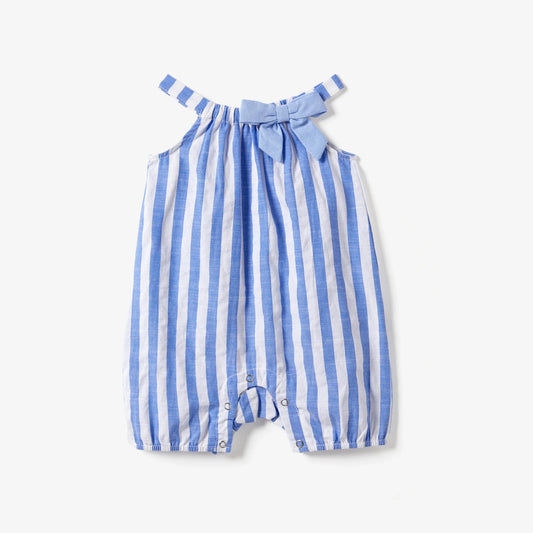 Family matching blue and white stripe dresses and shirts with tassel trim for summer vacation.