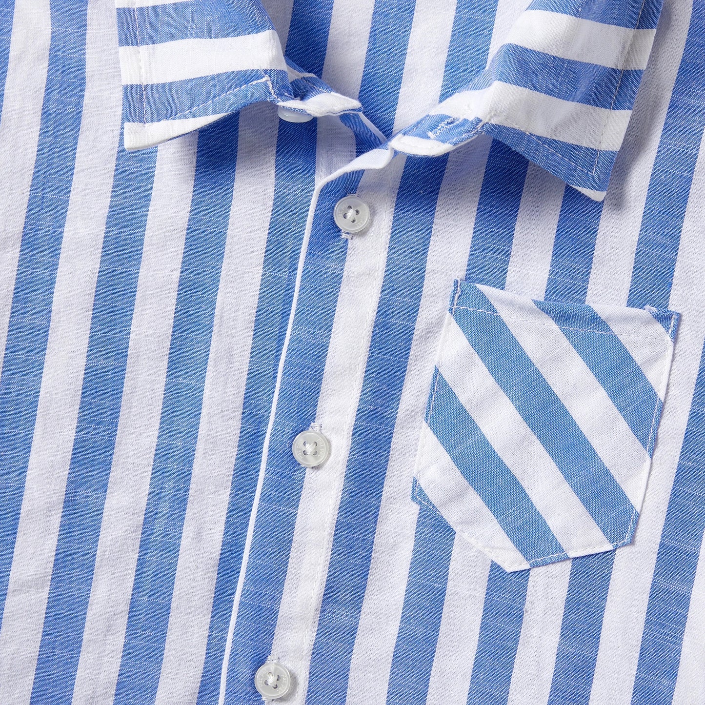 Display of the entire family matching stripe outfit collection, including dresses and shirts with tassels.
