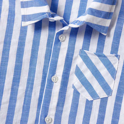 Display of the entire family matching stripe outfit collection, including dresses and shirts with tassels.