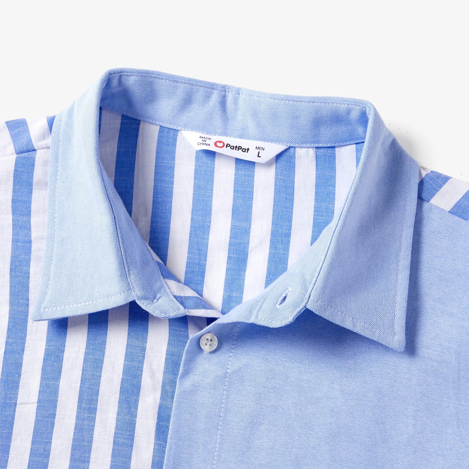 Detail of the tassel trim on the hem of a blue and white stripe family matching dress.