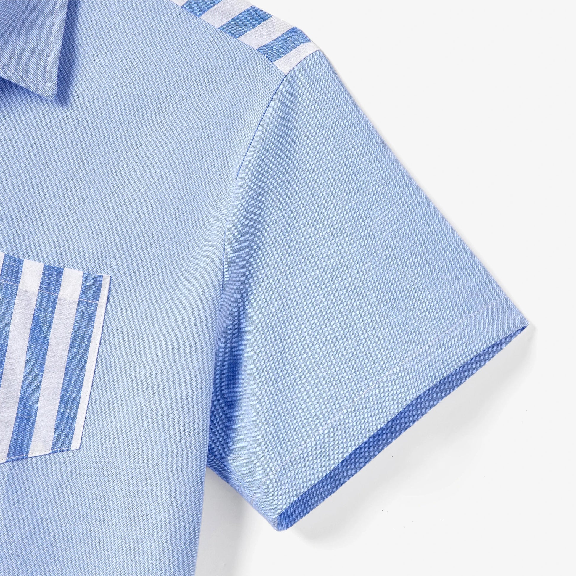 Family matching casual wear: blue and white stripe dresses and shirts, all featuring chic tassel trim.