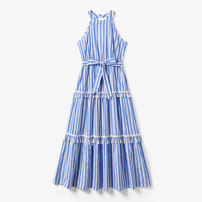 Dad, mom, son, and daughter wearing blue and white stripe outfits with playful tassel accents.