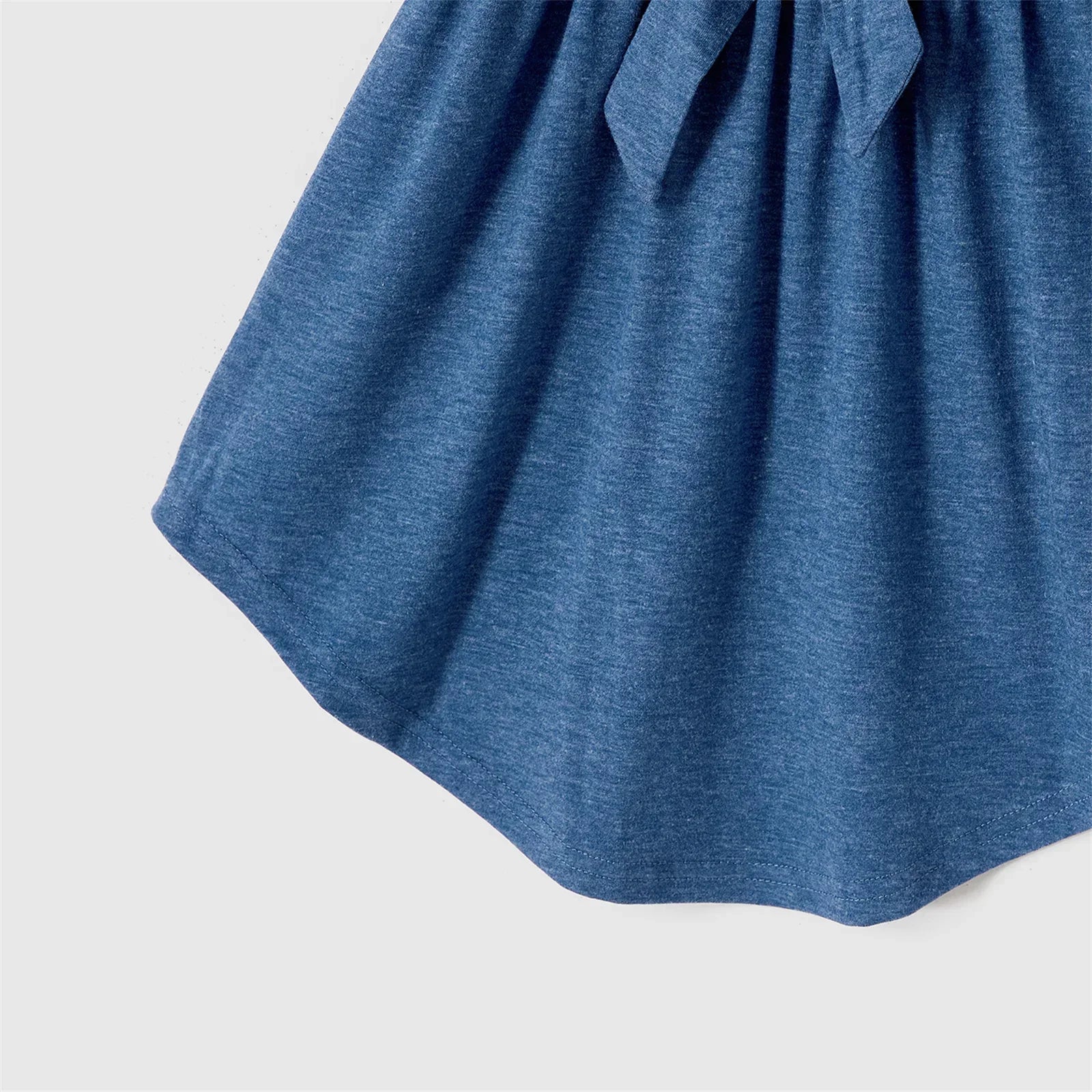 Detail shot of the blue belted dress fabric, polyester blend for comfort and easy care, summer style