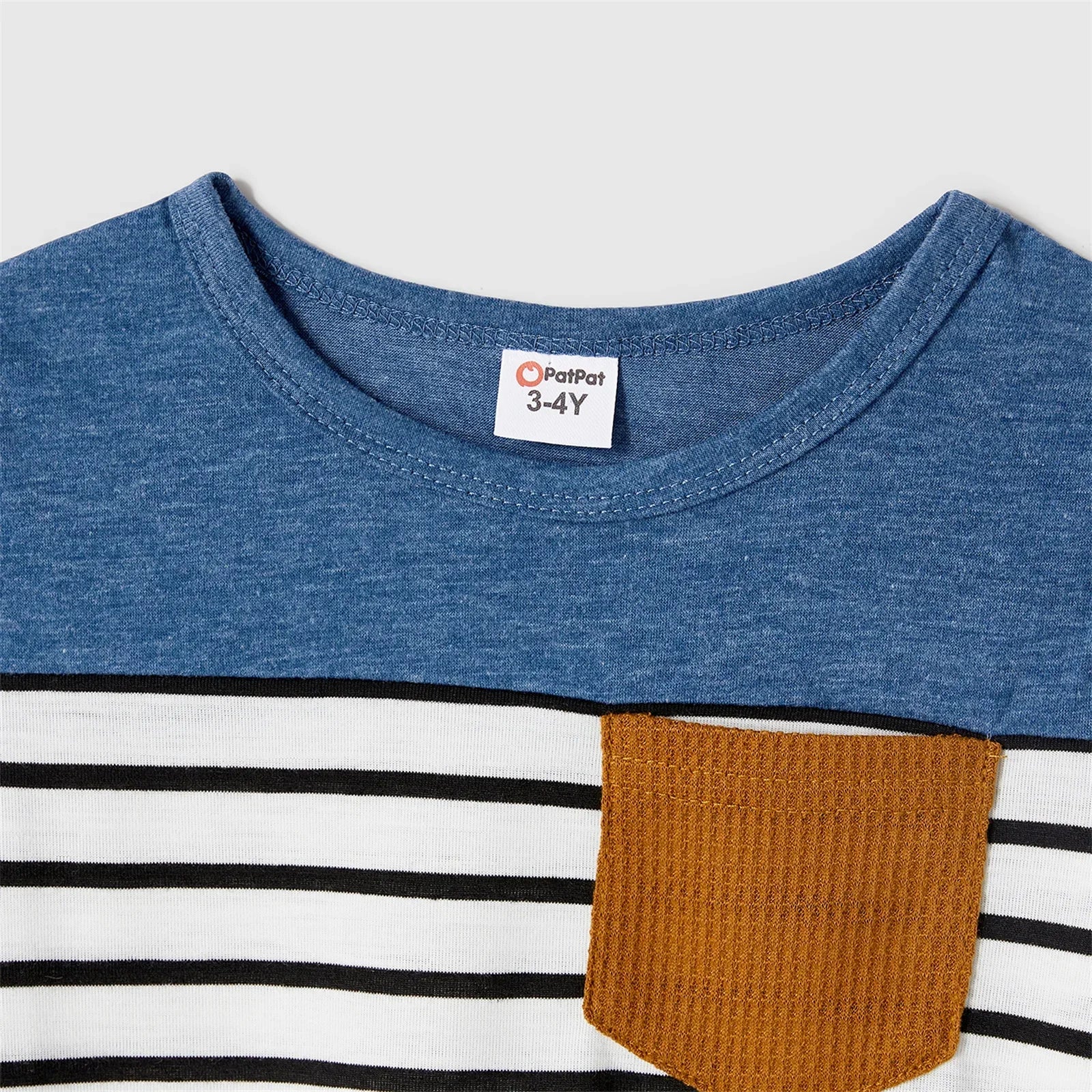 Matching family outfits featuring blue dresses & striped t-shirts, ideal for beach or family gatherings