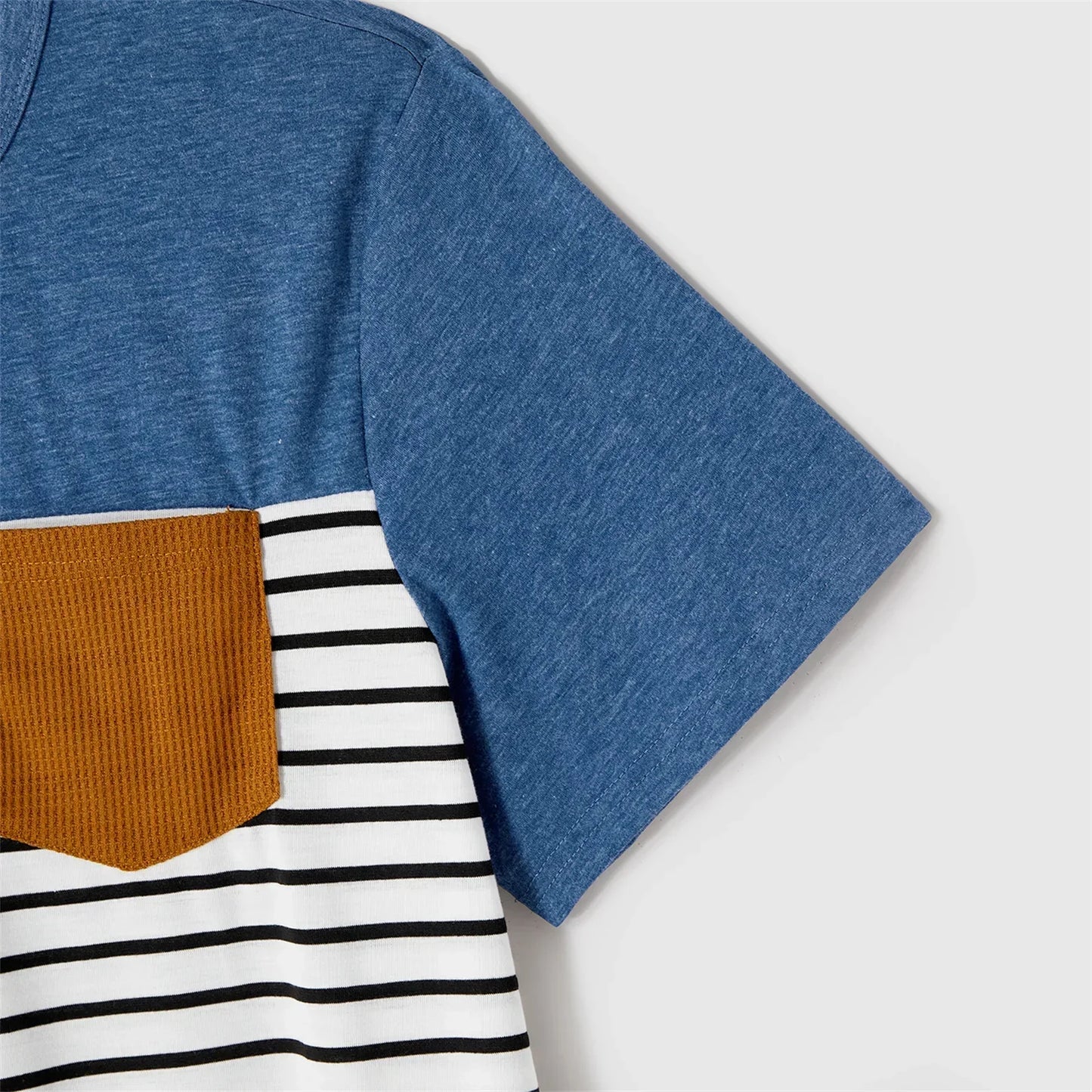 Various sizes of blue belted dresses and striped t-shirts, available in family matching set