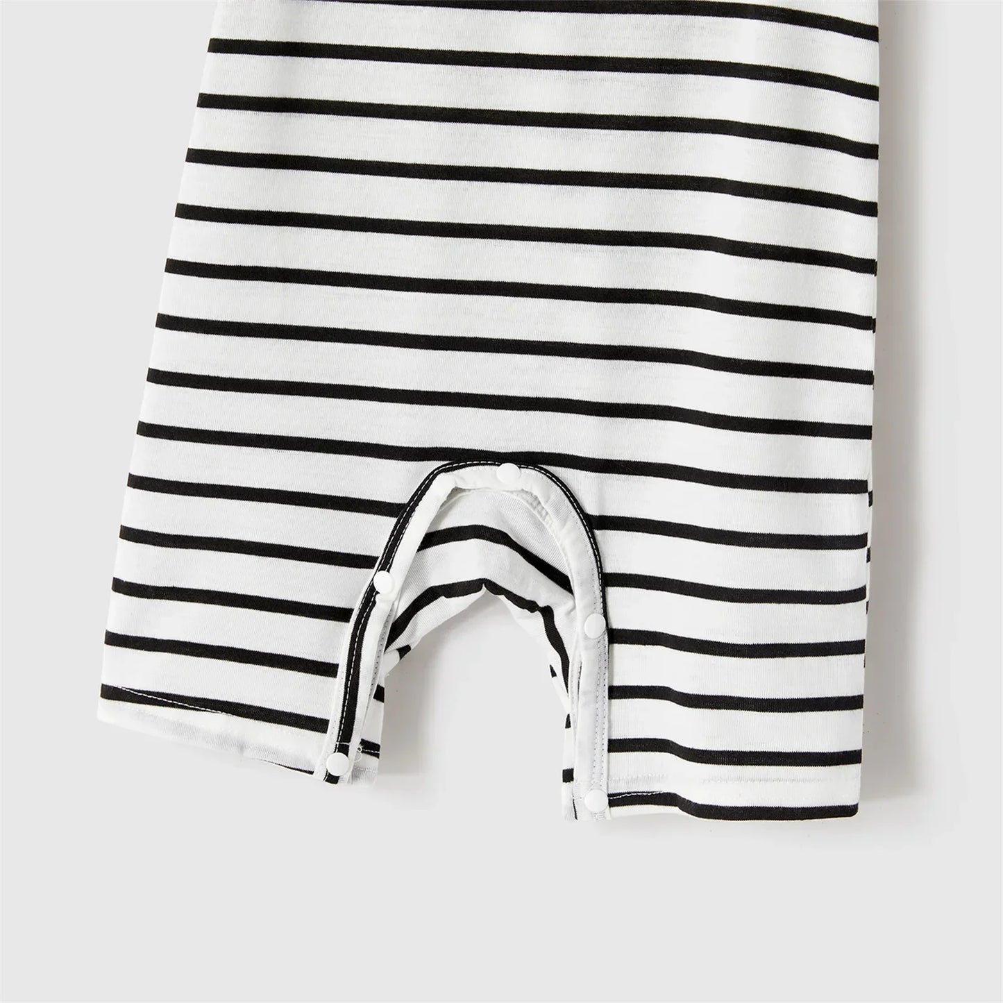 Summer family photoshoot: cheerful family in blue belted dresses and striped t-shirts, casual elegant
