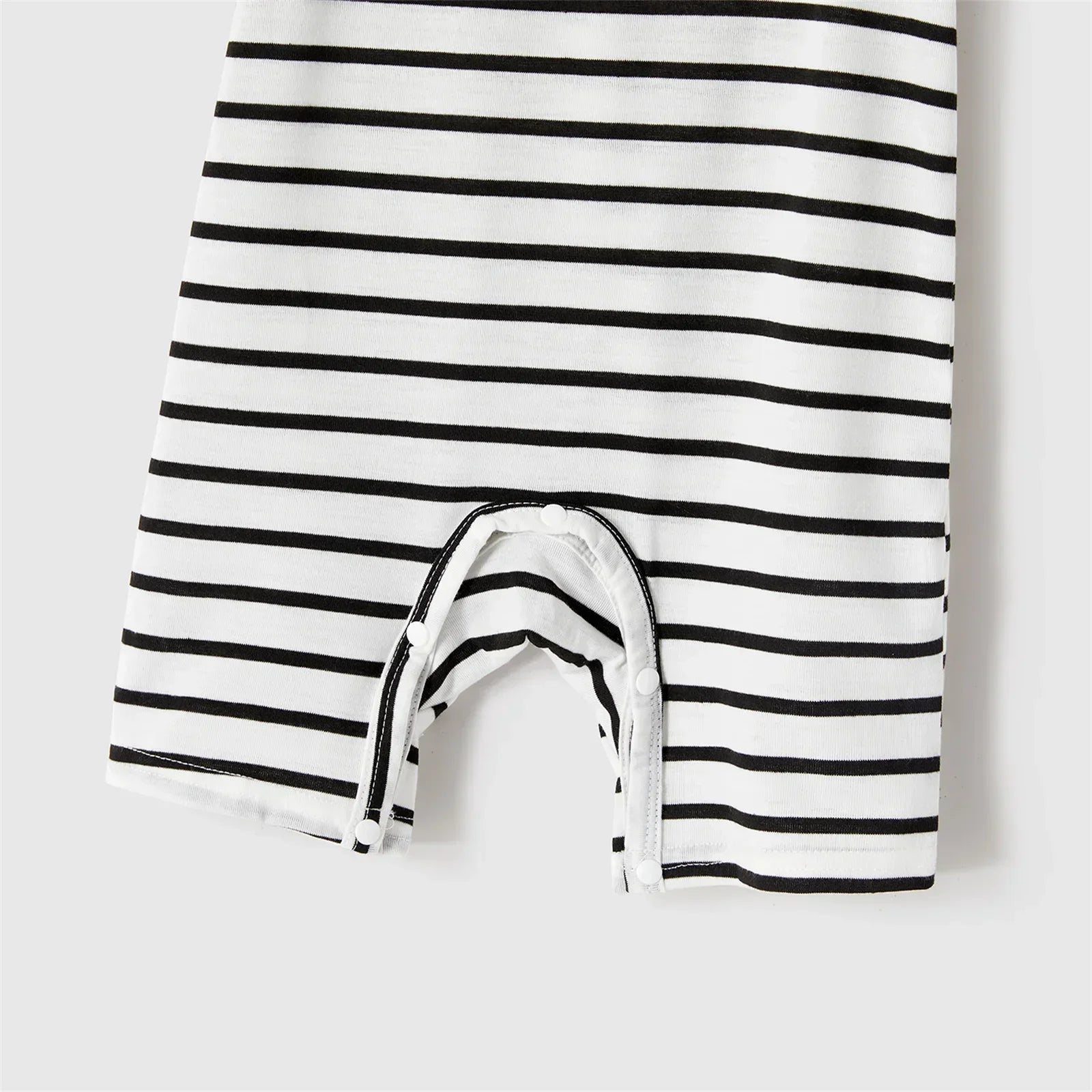 Summer family photoshoot: cheerful family in blue belted dresses and striped t-shirts, casual elegant