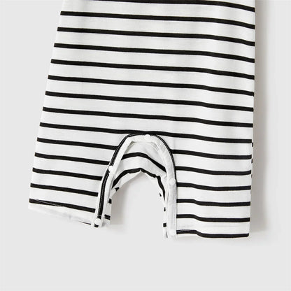 Summer family photoshoot: cheerful family in blue belted dresses and striped t-shirts, casual elegant