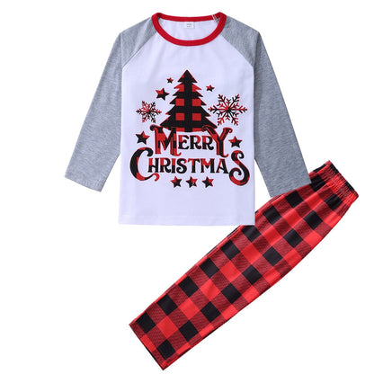Adult wearing cozy checkered Christmas pajamas, comfortable matching loungewear for holiday season