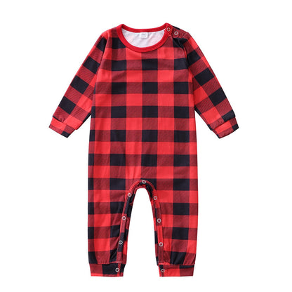 Close-up of checkered pattern on family Christmas pajamas, soft festive winter sleepwear