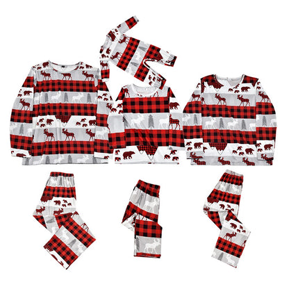 Family matching Christmas pajamas with pets, festive holiday wear for dog, cat, parents, and children